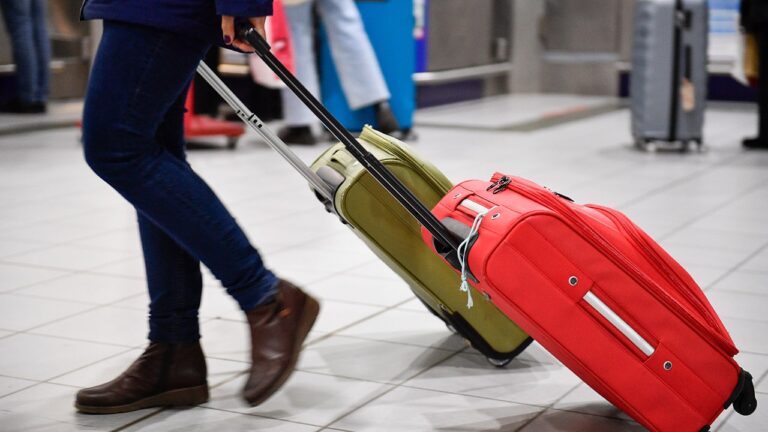 travelling with luggage at airport