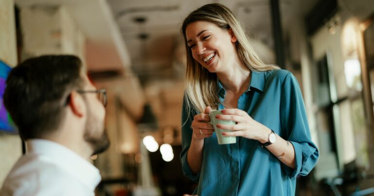 businessman businesswoman drinking coffee