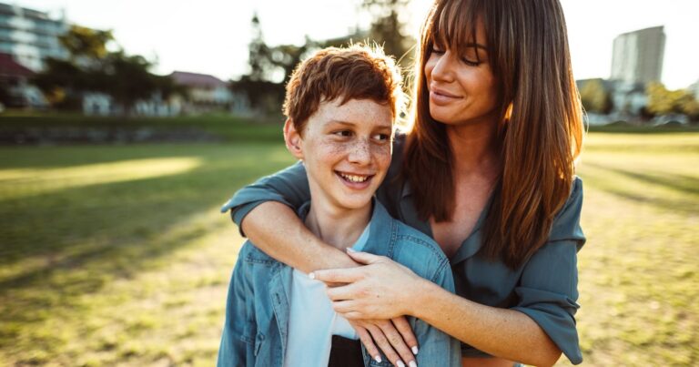 teenager embraced with mom